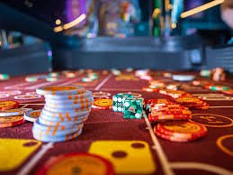 Roulette wheel and betting layout on live-dealer table